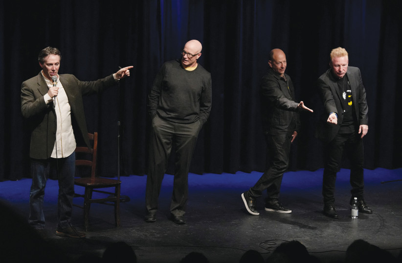  US comedians Brian Kiley, Peter Berman, Butch Bradley and Avi Liberman speak to an audience at the end of a ‘Comedy for Koby’ comedy show at a theatre in Tel Aviv, Israel January 21, 2024.  (credit: REUTERS/ALEXANDRE MENEGHINI)
