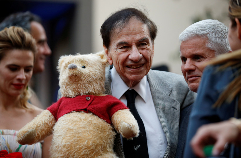  FILE PHOTO: Songwriter Richard M. Sherman holds a stuffed Winnie the Pooh as he poses at the world premiere of Disney's ''Christopher Robin,'' in Burbank, California, U.S., July 30, 2018. (credit: REUTERS/DANNY MOLOSHOK/FILE PHOTO)