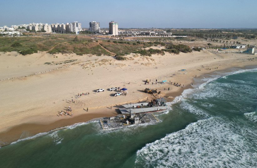 Vessels used for delivering aid to Gaza via US-built pier run aground in Ashdod, May 25, 2024 (credit: AMIR COHEN/REUTERS)