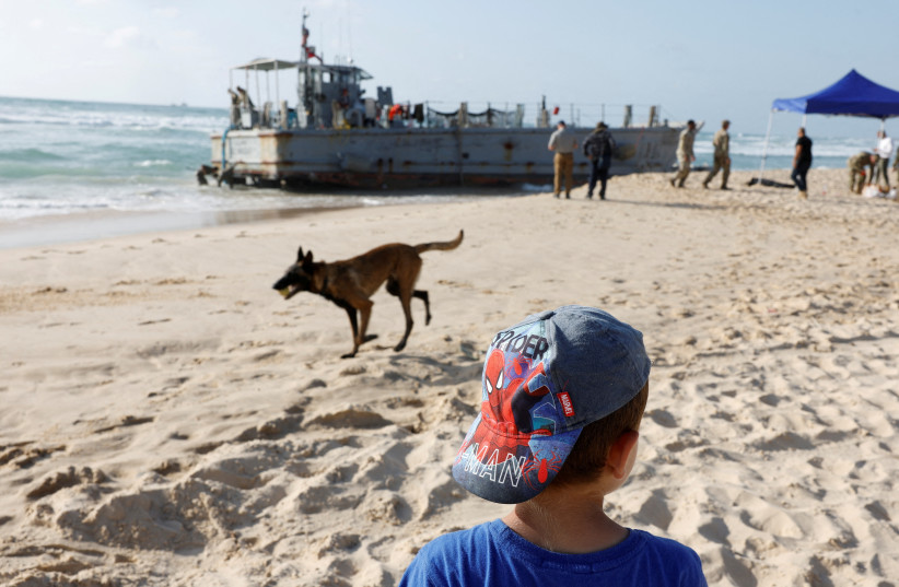 Vessels used for delivering aid to Gaza via US-built pier run aground in Ashdod, May 25, 2024 (credit: AMIR COHEN/REUTERS)
