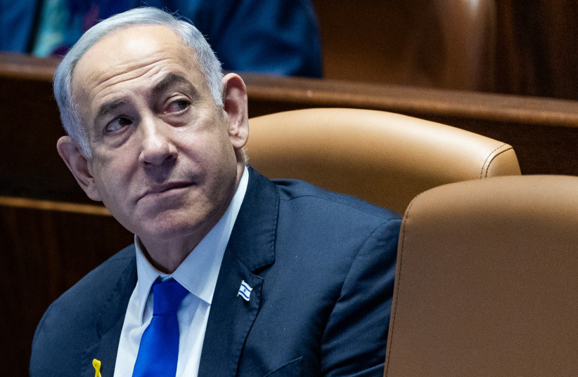 Prime Minister Benjamin Netanyahu seen at the plenum hall of the Knesset, the Israeli parliament in Jerusalem, on May 27, 2024 (credit: YONATAN SINDEL/FLASH90)