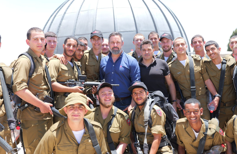 Spanish Opposition Leader Santiago Abascal (right) and Diaspora Minsiter Amichai Chikli (left) meet with IDF troops, May 29, 2024. (credit: Veo Israel)