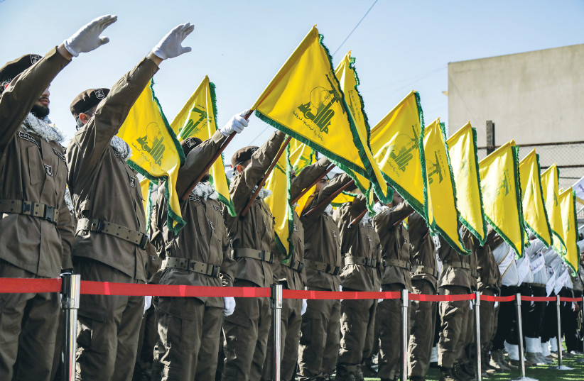  HEZBOLLAH OPERATIVES salute during the funeral of comrades killed in an Israeli strike, in Shehabiya, south Lebanon, April 17. (credit: AFP VIA GETTY IMAGES)