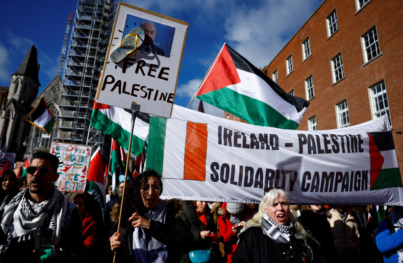  Demonstrators hold signs in support of Palestine, amid the ongoing conflict between Israel and the Palestinian Islamist group Hamas, during a ‘Stand Together’ solidarity march against war, hate and racism, in Dublin, Ireland, March 2, 2024. (credit: Clodagh Kilcoyn/Reuters)