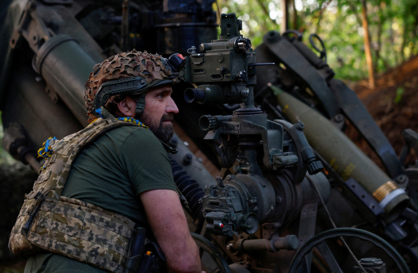  A Ukrainian serviceman of the 148th Separate Artillery Brigade of the Ukrainian Air Assault Forces, prepares to fire a M777 howitzer toward Russian troops near a front line, amid Russia’s attack on Ukraine, in Donetsk region, Ukraine May 1, 2024. (credit: REUTERS/VALENTYN OGIRENKO/FILE PHOTO)