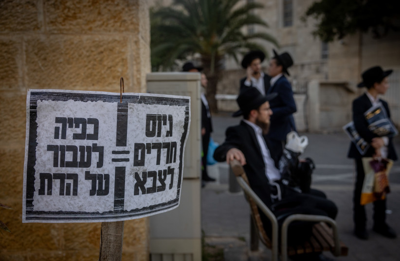 Ultra-Orthodox Jews protest against the drafting of haredim to the IDF, in Jerusalem, June 2, 2024 (credit: Chaim Goldberg/Flash90)