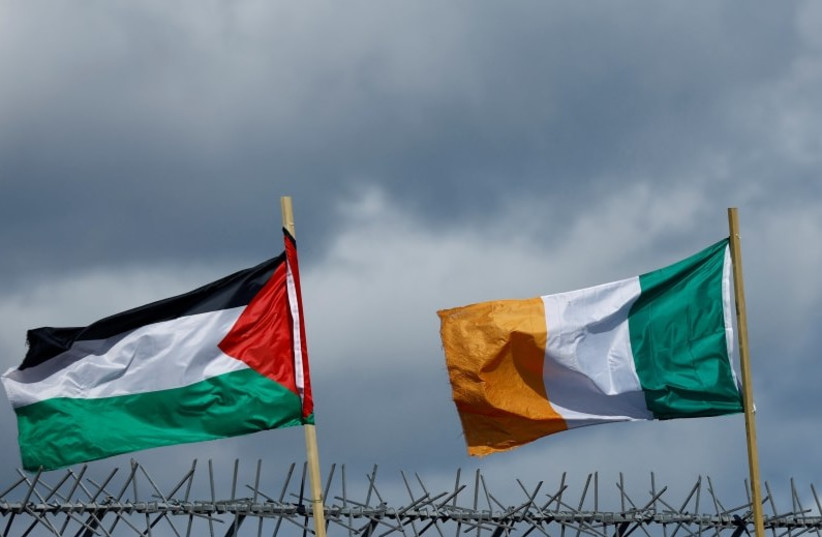  Flags of Palestine and Ireland flutter next to each other over the International Wall in support of Gaza, amid the ongoing conflict between Israel and the Palestinian terror group Hamas, in Belfast, Northern Ireland, March 29, 2024. (credit: CLODAGH KILCOYNE/REUTERS)