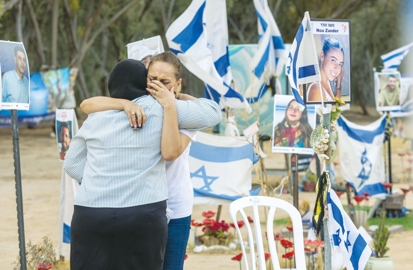 MOURNERS VISIT the site of the Nova festival massacre, in Re’im forest, near the Israel-Gaza border. It’s also vital to acknowledge the thousands of survivors who are struggling, the writer asserts. (credit: YOSSI ALONI/FLASH90)