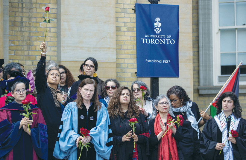  PRO-PALESTINIAN protesters, university staff and other supporters hold a graduation ceremony in honor of those in Gaza, near the encampment at the University of Toronto on the first day of convocation, on Monday.  (credit: CARLOS OSORIO/REUTERS)
