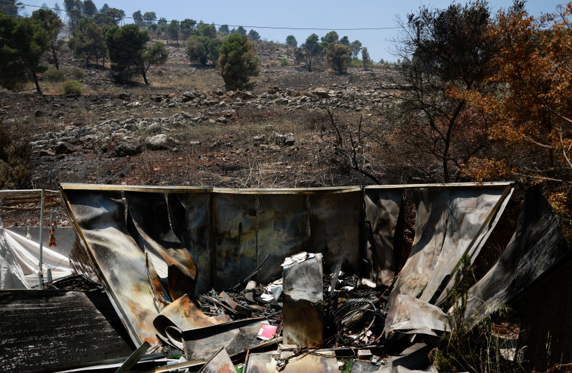  Wreckage lies in the garden of a house hit in rocket attacks from Lebanon, amid ongoing cross-border hostilities between Hezbollah and Israeli forces, in Kiryat Shmona, northern Israel, June 4, 2024.  (credit: AMMAR AWAD/REUTERS)