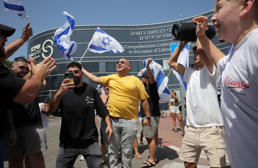 Israelis celebrate the release of four hostages in Ramat Gan on June 8, 2024 (credit: REUTERS/MARKO DJURICA)