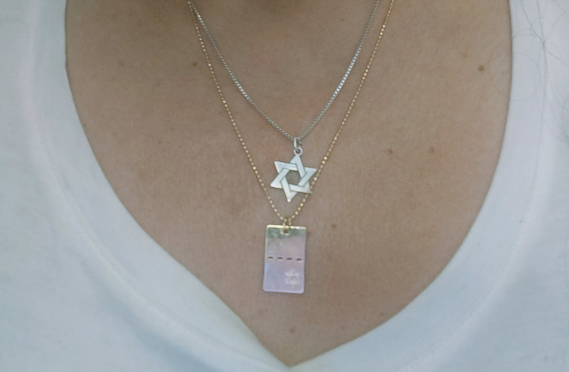 A NECKLACE with a Star of David.