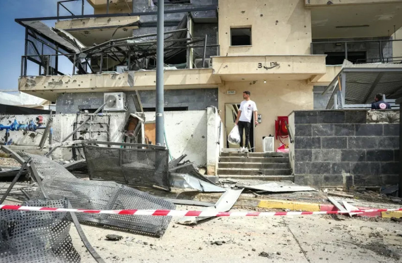  A building in Kiryat Shmona that was hit by a Hezbollah rocket  (credit: Eyal margolin / Flash 90)