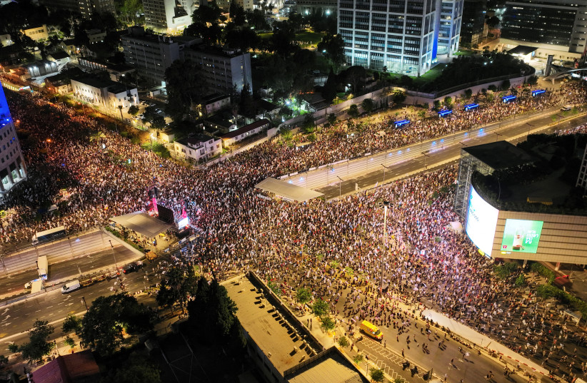  Israeli demonstrators protest outside Hakirya Base in Tel Aviv, June 15, 2024 (credit: REUTERS/AVIV ATLAS)