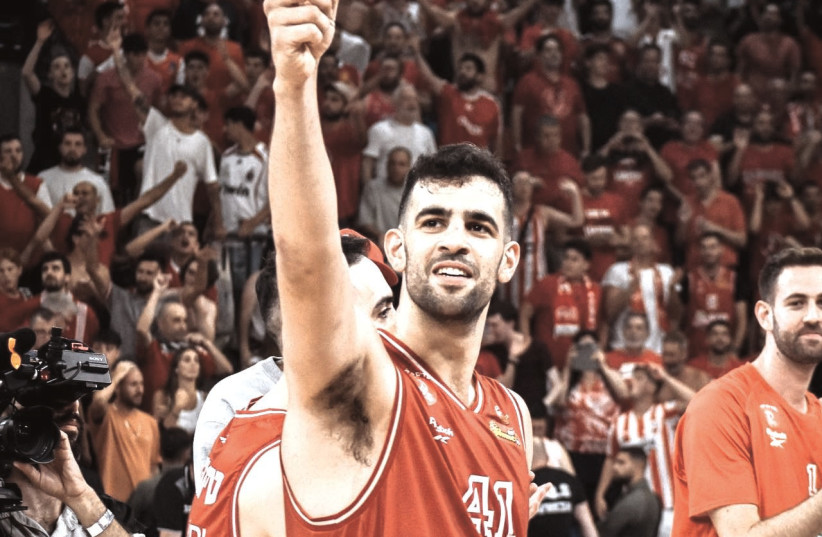  HAPOEL TEL AVIV’S Tomer Ginat celebrates after the Reds’ 85-67 victory over Maccabi Tel Aviv on Saturday at the Drive-In Arena to force a decisive finals Game 3. (credit: YEHUDA HALICKMAN)