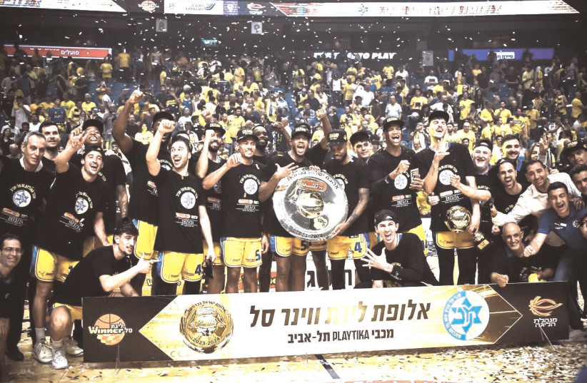  MACCABI TEL AVIV celebrates after clinching the Israel league championship with a 82-74 Game 3 win over Hapoel Tel Aviv. (credit: YEHUDA HALICKMAN)
