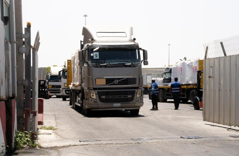  Trucks carrying aid are seen entering the Gaza Strip through the Kerem Shalom, June 18, 2024 (credit: IDF SPOKESPERSON'S UNIT)