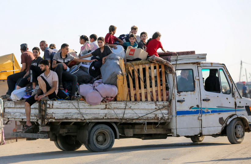  Palestinians flee Rafah due to an Israeli military operation, amid the Israel-Hamas conflict, in Rafah, in the southern Gaza Strip, June 7, 2024. (credit: Hatem Khaled/Reuters)