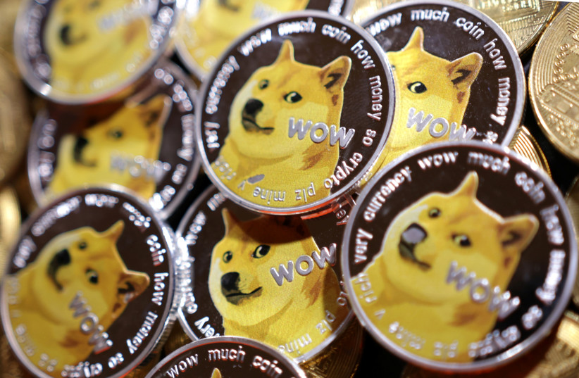  Representations of cryptocurrency Dogecoin are seen in this illustration taken June 16, 2022. (credit: DADO RUVIC/REUTERS)