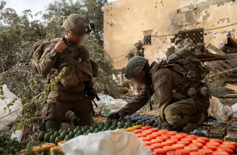 IDF soldiers with seized weapons in Rafah, June 20, 2024. (credit: IDF SPOKESPERSON'S UNIT)