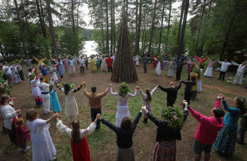  People attend Ivan Kupala festival, marking the day of the summer solstice, in Leningrad Region, Russia June 20, 2024. (credit: REUTERS/ANTON VAGANOV)