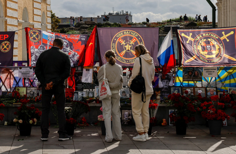  People visit a makeshift memorial for Yevgeny Prigozhin, head of the Wagner mercenary group, and Dmitry Utkin, the group commander, while marking 40 days since their death to respect an Orthodox tradition, in central Moscow, Russia, October 1, 2023.  (credit:  REUTERS/Evgenia Novozhenina)