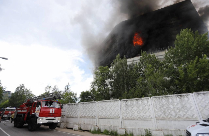  Fire and smoke billow from a burning administrative building in Fryazino in the Moscow Region, Russia June 24, 2024. (credit: VIA REUTERS)