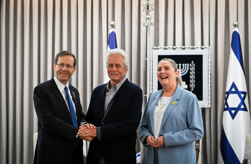  Israeli President Isaac Herzog and his Michal meet with American actor Michael Douglas at the President residence in Jerusalem, June 2, 2024. (credit: Arie Leib Abrams/Flash90)