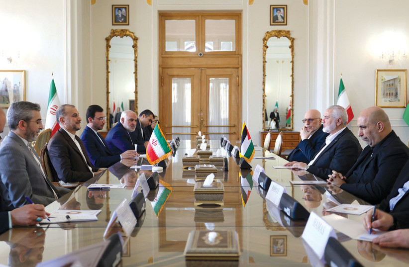 Iran’s Foreign Minister Hossein Amir Abdollahian meets Hamas leader Ismail Haniyeh in Tehran on March 26.
