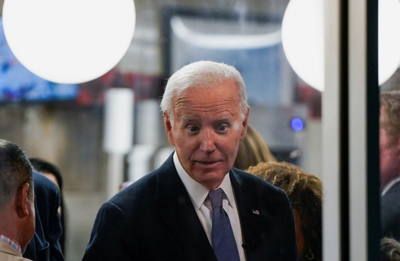  U.S. President Joe Biden reacts during a visit to a Waffle House, in Marietta, Georgia, after participating in a presidential debate in Atlanta, Georgia, U.S., June 28, 2024.  (credit: REUTERS/ELIZABETH FRANTZ)