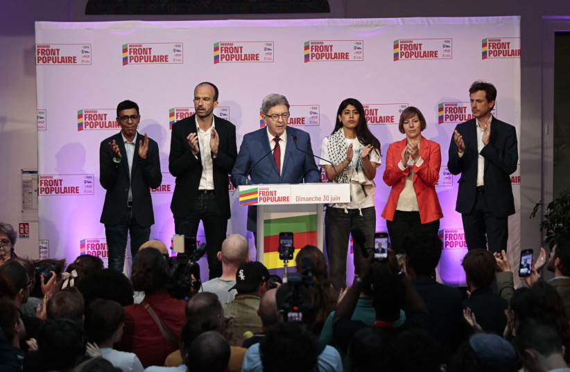  Jean-Luc Melenchon, leader of French far-left opposition party La France Insoumise (LFI) surrounded by Manuel Bompard and Rima Hassan, all members of the alliance of left-wing parties, called the ''Nouveau Front Populaire'' (NFP), delivers a speech. Paris, June 30, 2024.  (credit: REUTERS/Abdul Saboor)