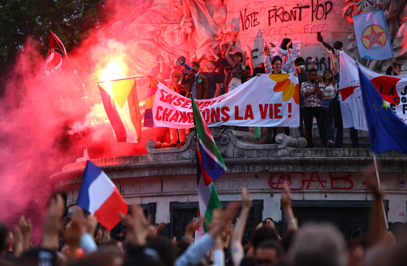  People gather to protest against the French far-right Rassemblement National (National Rally - RN) party, at Place de la Republique following partial results in the first round of the early 2024 legislative elections, in Paris, France, June 30, 2024.  (credit: REUTERS/FABRIZIO BENSCH)