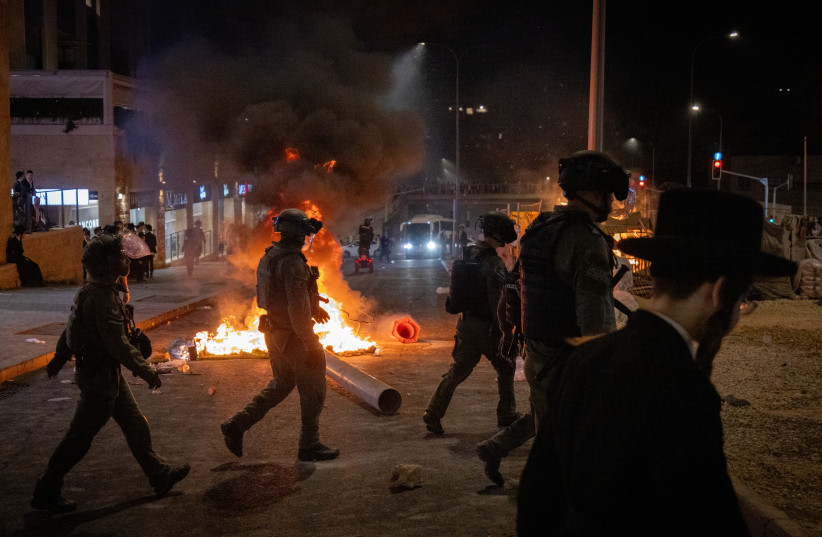  Police clash with demonstrators during a protest against the recruitment of Ultra orthodox Jews to the IDF, in Jerusalem, June 30, 2024.  (credit: CHAIM GOLDBEG/FLASH90)