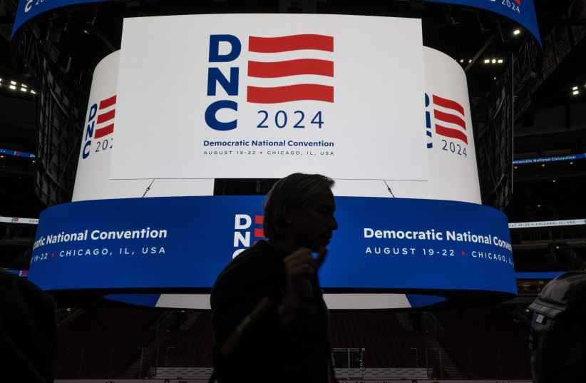 The logo for the Democratic National Convention is displayed on the scoreboard at the United Center during a media walkthrough in Chicago, Jan. 18, 2024.