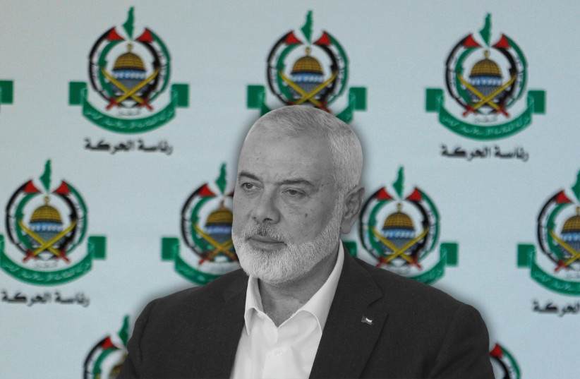 Hamas's assassinated leader Ismail Haniyeh. Hamas logos are seen in the background.
