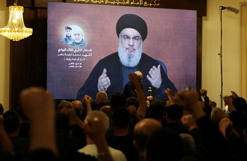 HEZBOLLAH LEADER Hassan Nasrallah addresses a memorial service, in Lebanon last month, for Hezbollah senior commander Mohammed Nasser, killed in a June Israeli strike.