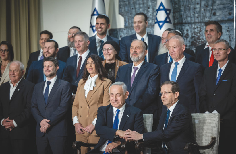 PRESIDENT ISAAC HERZOG and Prime Minister Benjamin Netanyahu pose for a group photo of the new cabinet, at the President’s Residence in Jerusalem, on December 29, 2022.