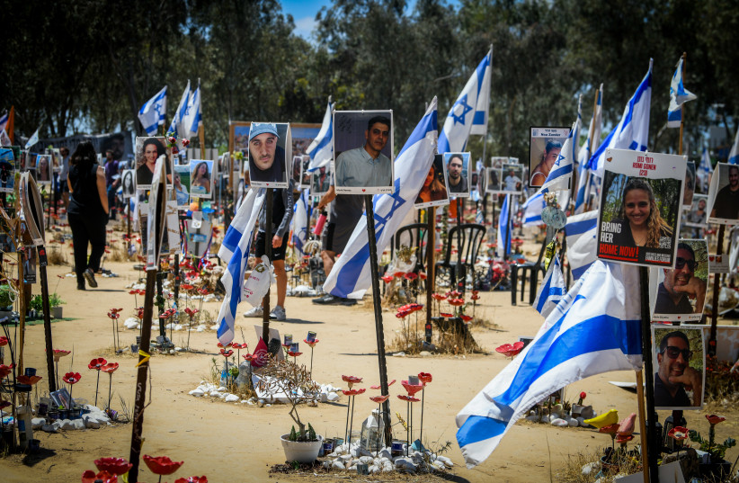 Israelis visit the site of the Re'im music festival massacre, in southern Israel, May 15, 2024.