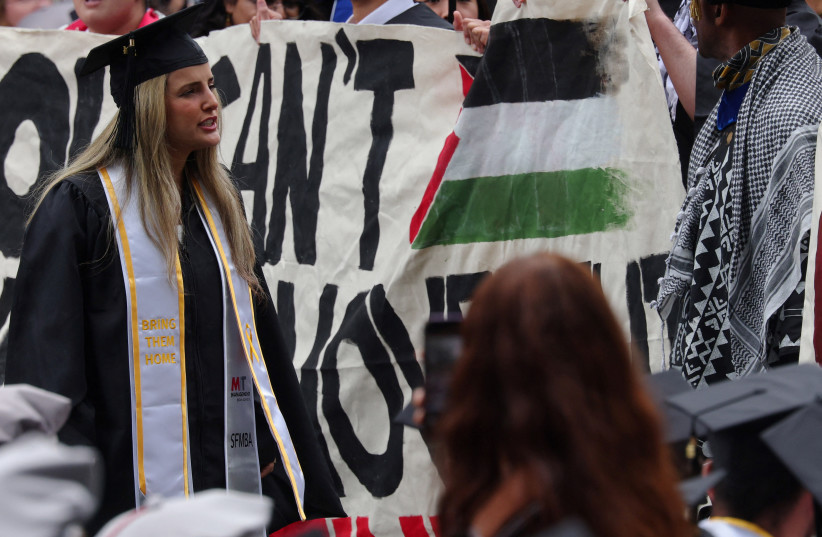 A graduating student wearing a stole with the words ''Bring Them Home'' confronts fellow students taking part in a pro-Palestinian demonstration and walk-out of Commencement ceremonies at the Massachusetts Institute of Technology. May 30, 2024.