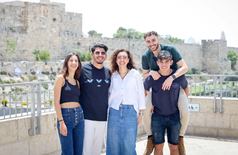 A new immigrant, an Israeli and an international student strolling together at Hebrew University's Safra campus at Givat Ram, in Jerusalem.