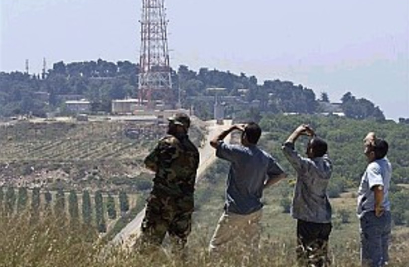 hizbullah watching 298 (photo credit: AP)
