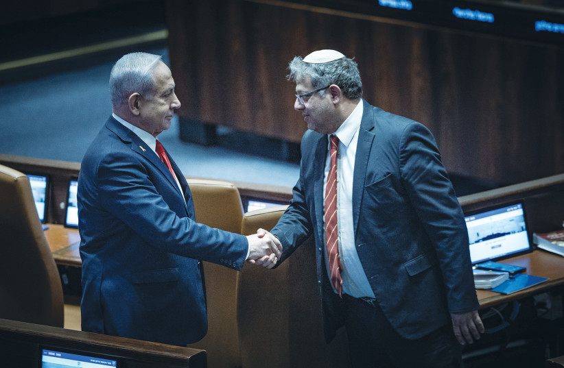 PRIME MINISTER Benjamin Netanyahu shakes hands with National Security Minister Itamar Ben-Gvir during a debate in the Knesset plenum earlier this year. Netanyahu, Bezalel Smotrich, and Ben-Gvir embody fear Zionism; they do not speak for all Zionists, says the writer.