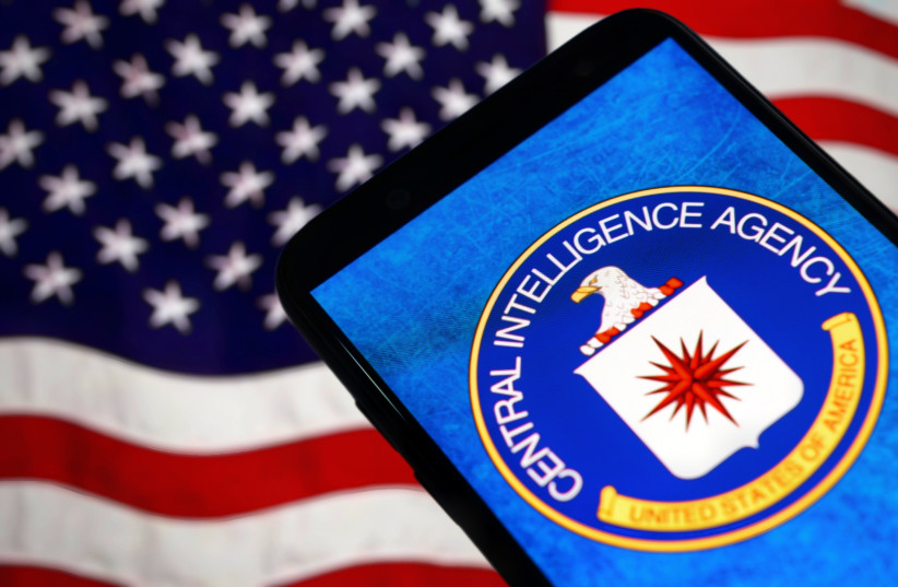 A graphic showing a Central Intelligence Agency logo on a phone in front of a US flag.