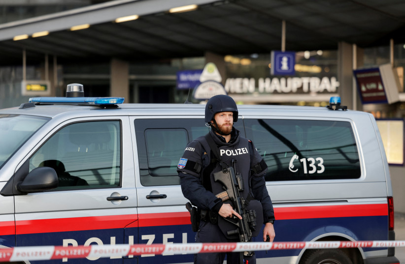 A police officer stands guard in front of Vienna Central Station, after it was closed due to an unspecified threat, according to the Austrian capital's police and national rail company OBB, in Vienna, Austria, March 3, 2025