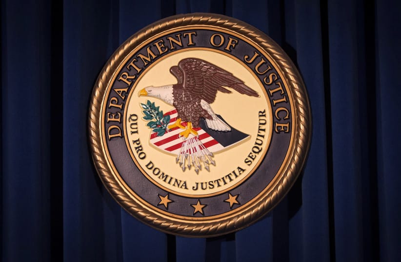 The Department of Justice logo is pictured on a wall after a news conference in New York, December 5, 2013; illustrative.