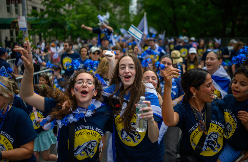 Participants cheer and dance during the Celebrate Israel Parade up Fifth Avenue on May 18, 2025 in New York City.