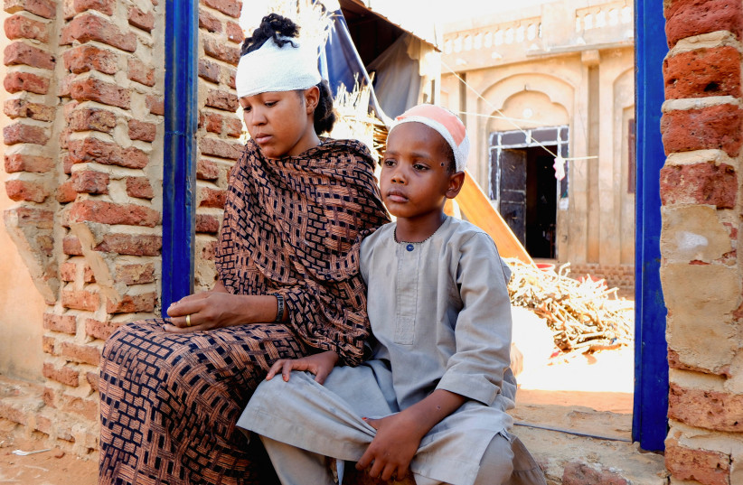 People injured during a drone strike sit in El Obeid, North Kordofan State, Sudan, January 12, 2026.