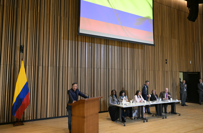 Colombian President Gustavo Petro (L) speaks during a meeting with members of the Colombian diaspora at the Martin Luther King Jr. Memorial Library in Washington, DC, on February 5, 2026.