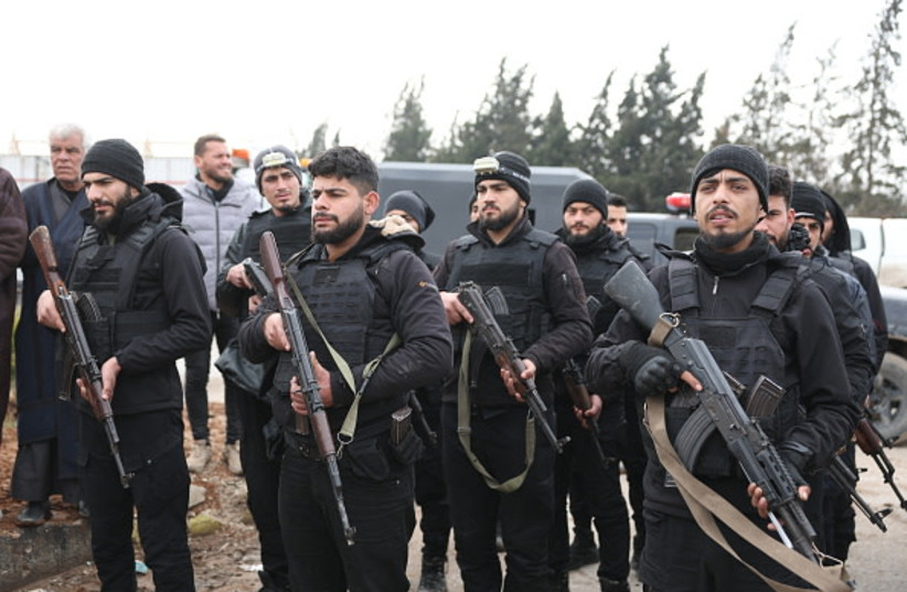 Members of the Syrian government internal security forces gather in the northern Syrian town of Sirrin as they wait to enter the city of Kobane on February 2, 2026.