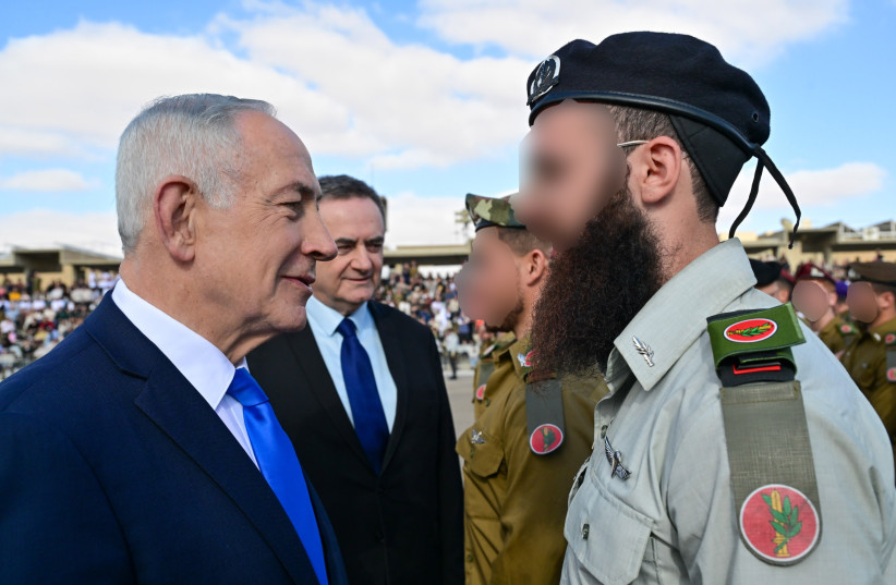 Prime Minister Benjamin Netanyahu is seen during an IDF combat officer graduation ceremony